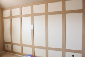 Boxes on paneled wall